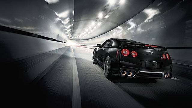 2023 Nissan GT-R seen from behind driving through a tunnel | Gunn Nissan in San Antonio TX