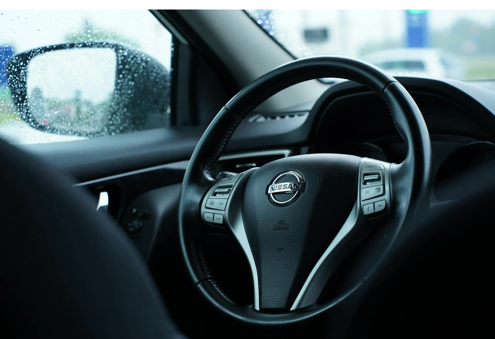 close-up view of a nissan steering wheel